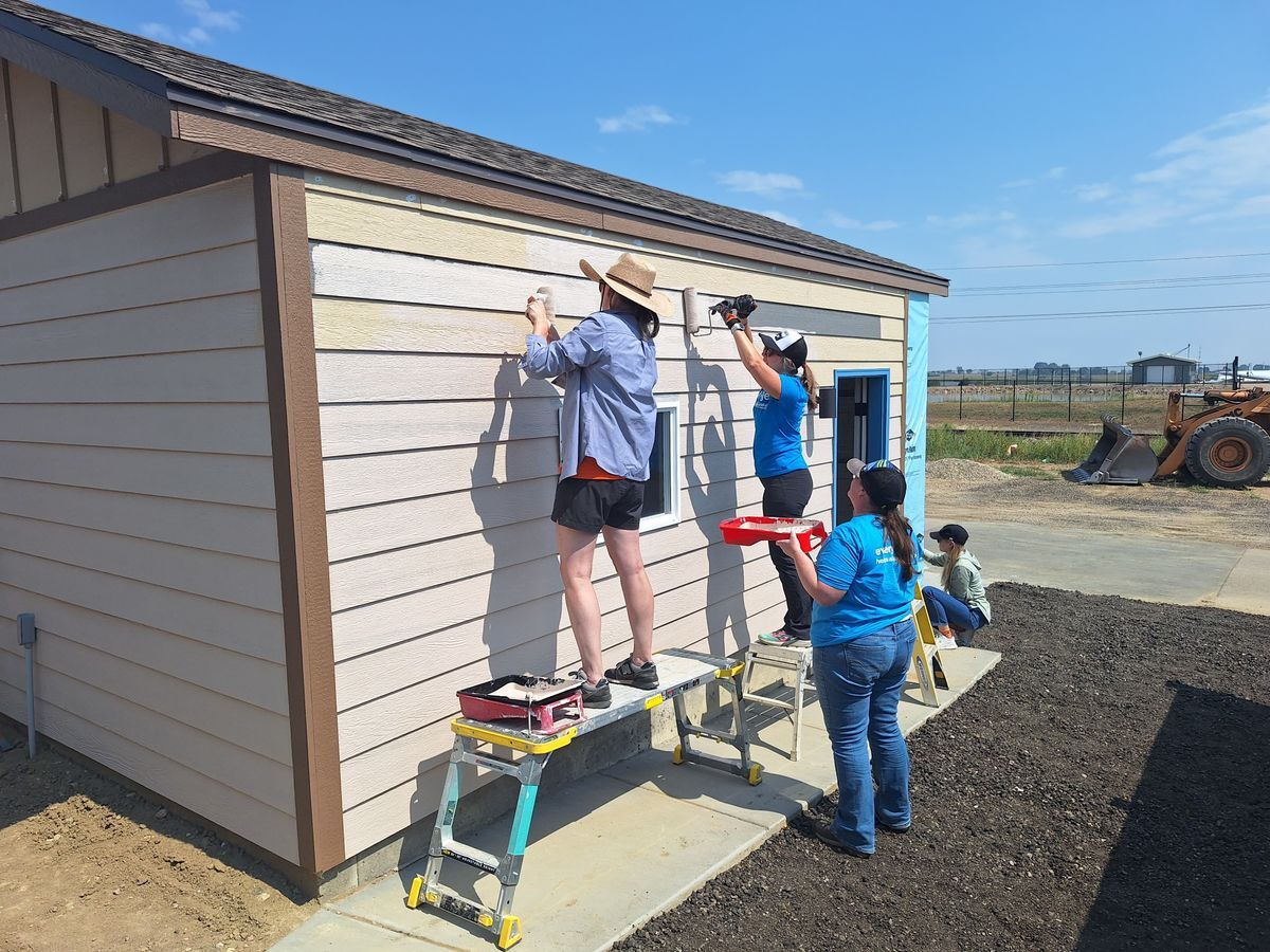 Habitat Colorado Build: Volunteer Painting outside of the garage
