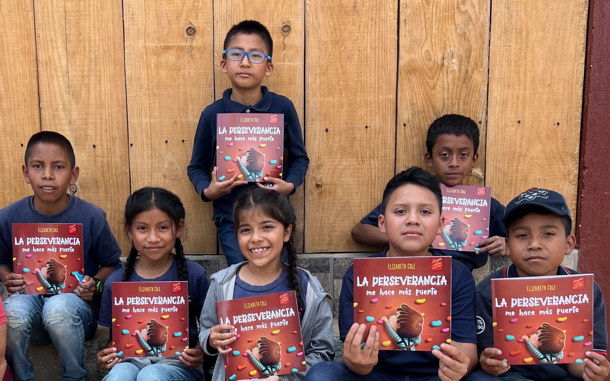 Group of kids holding new books