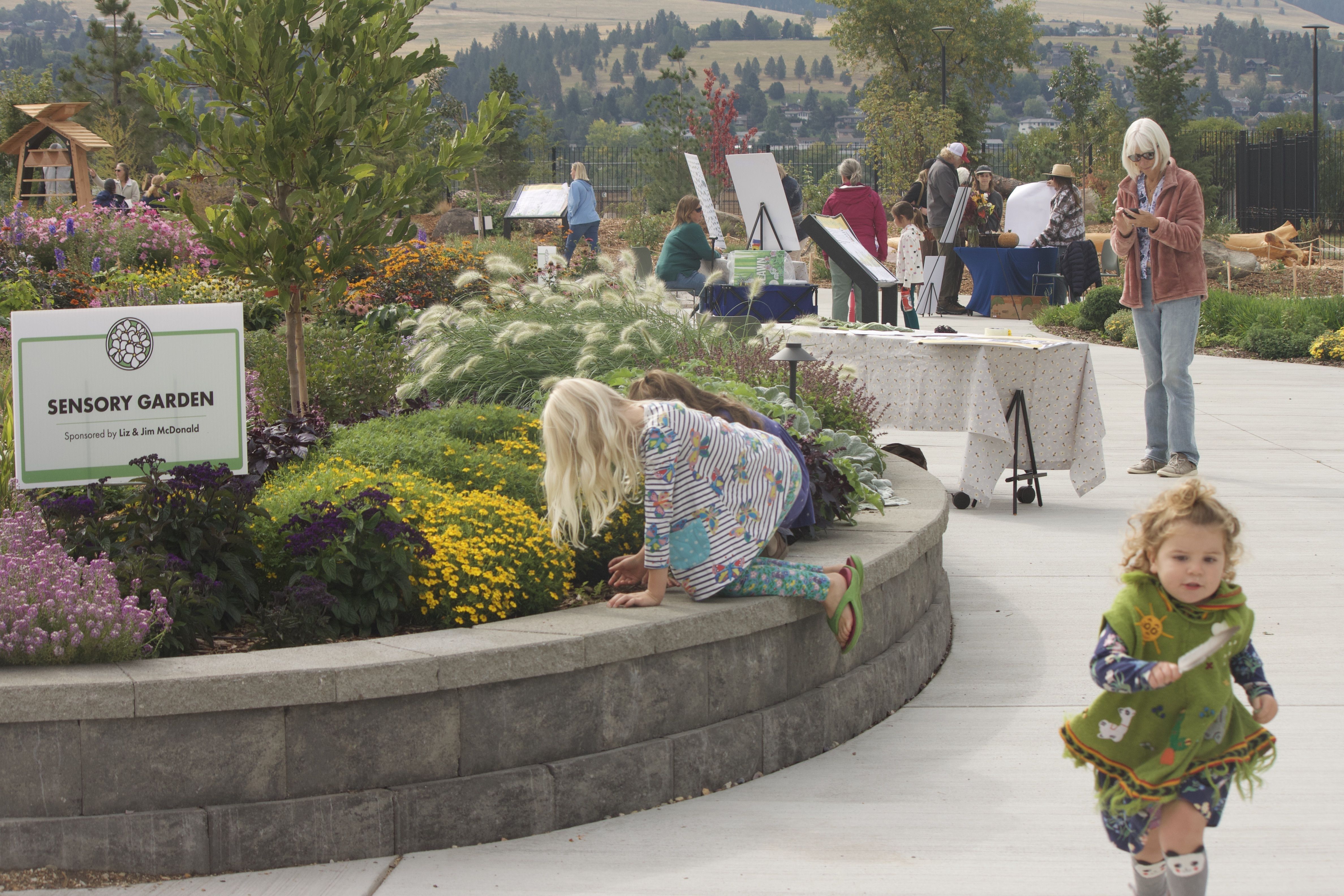 Children explore a sensory garden during the Rocky Mountain Gardens grand opening.