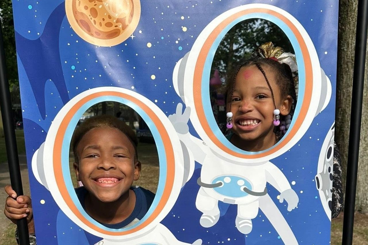 Kids posing as astronauts at a back to school event in Erie PA