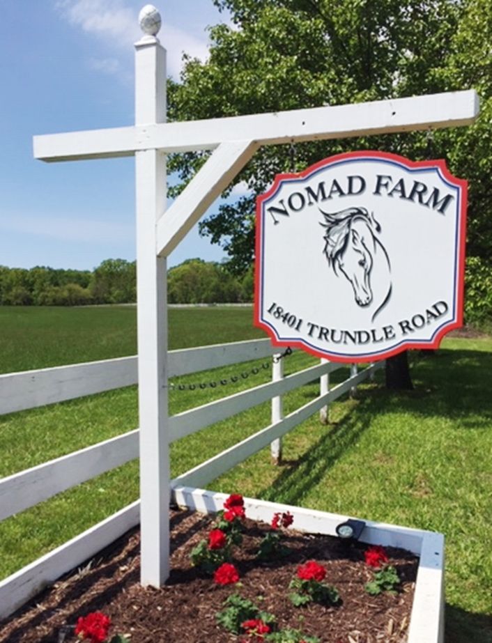 P25047 - Carved Entrance and Address Sign  for "Nomad Farm"  Hung from a Wood Beam Supported by a Wood Post