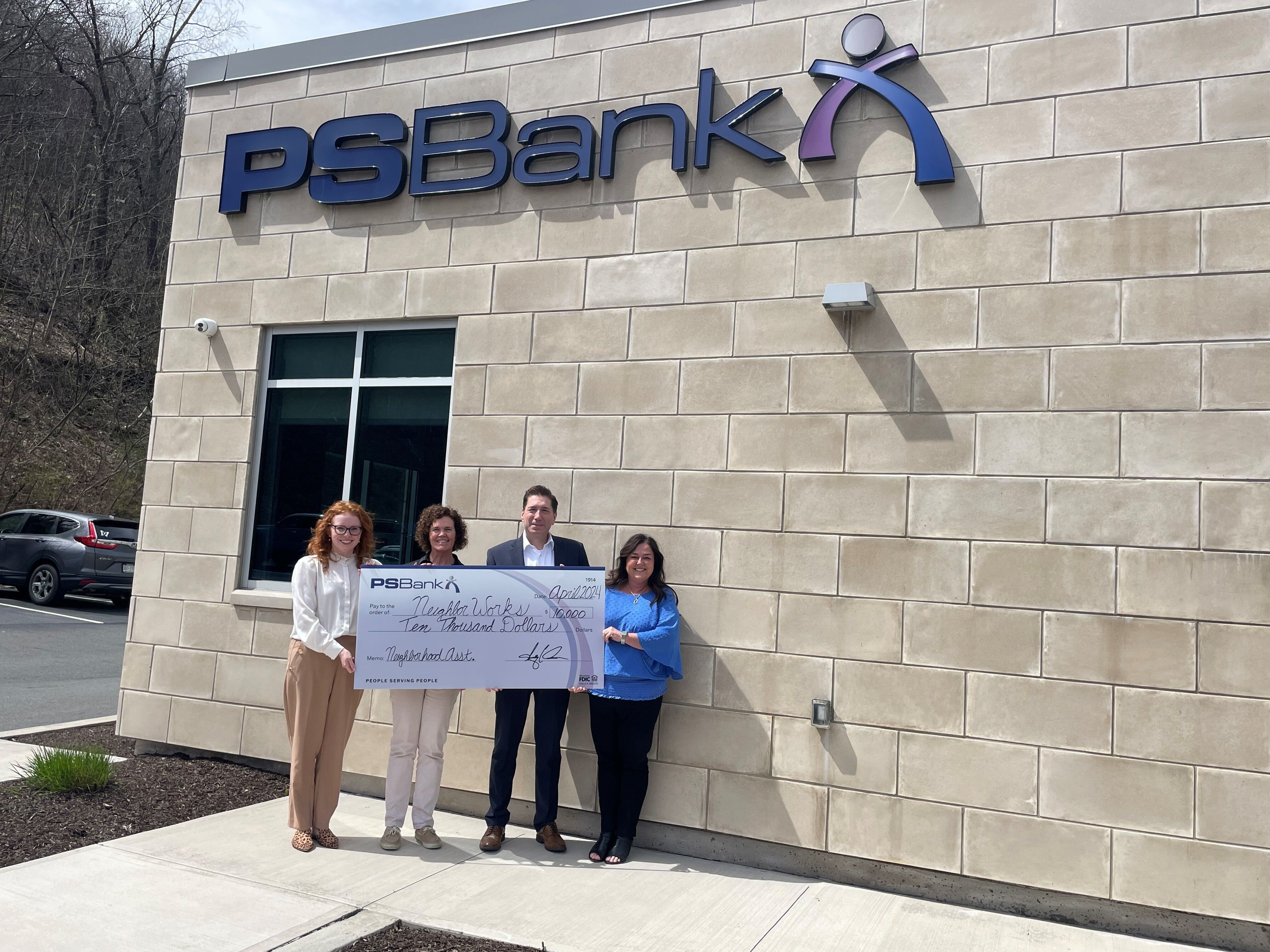 NeighborWorks receives contribution from PS Bank through Neighborhood Assistance Program