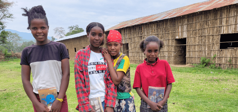 A wide road through a rural Ethiopian town, symbolizing the long-term impact of legacy gifts.