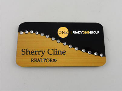 Realty One Two Tone Gold and Black Swirl