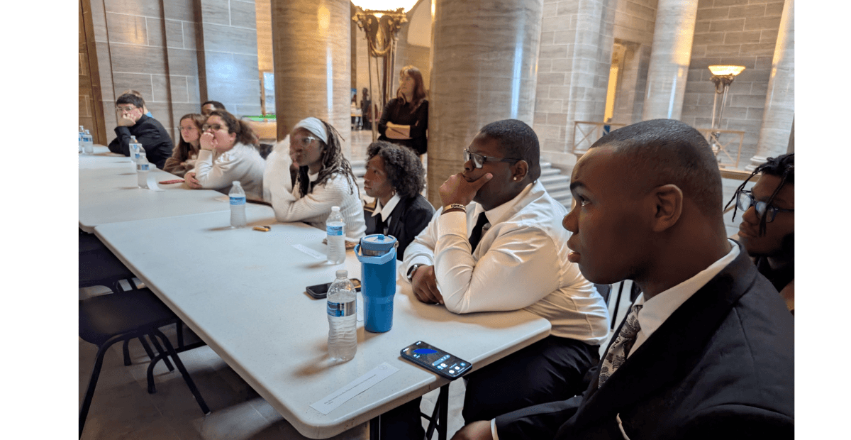 students sitting at a table 