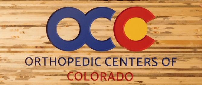 B11072 - Carved, Woodgrain Pattern, HDU Sign with Logo for Colorado Orthopedic Center
