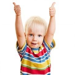 Toddler giving two thumbs up.