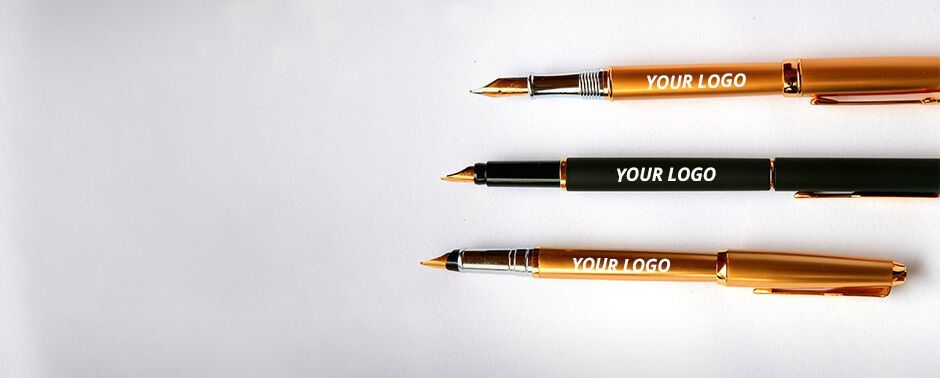 Three pens with white text "Your Logo" displayed on the side of each.