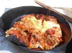 Cooked pizza dish.