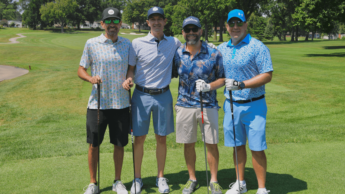 foursome of golfers