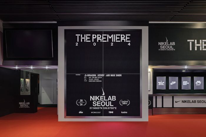 Instagram worthy wall display for "The Premiere" event at NikeLab Seoul, featuring bold typography on a red carpet retail installation.
