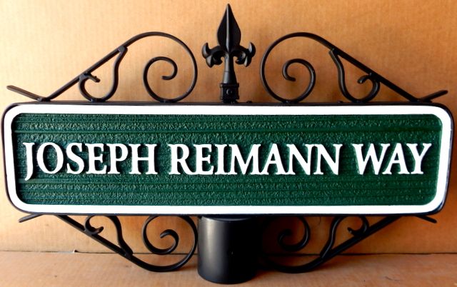 M17064- Carved HDU Street Name Sign, Joseph Riemann Way, mounted on Post with Ornate Scroll Bracket