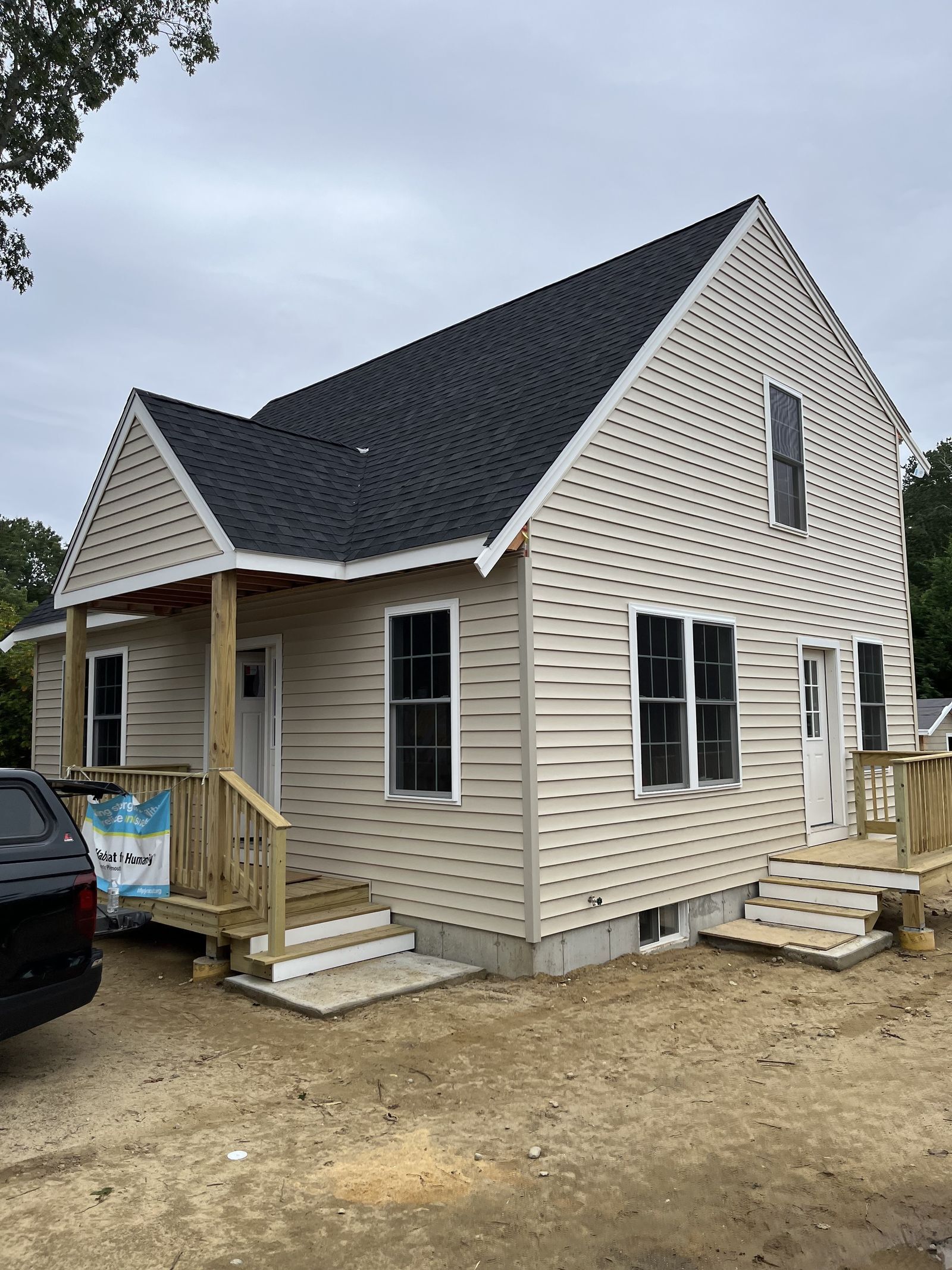 Photo of the exterior of a home with beige siding