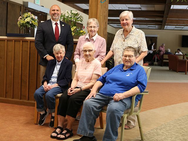 Rep. Bob Merski congratulates jubilarians