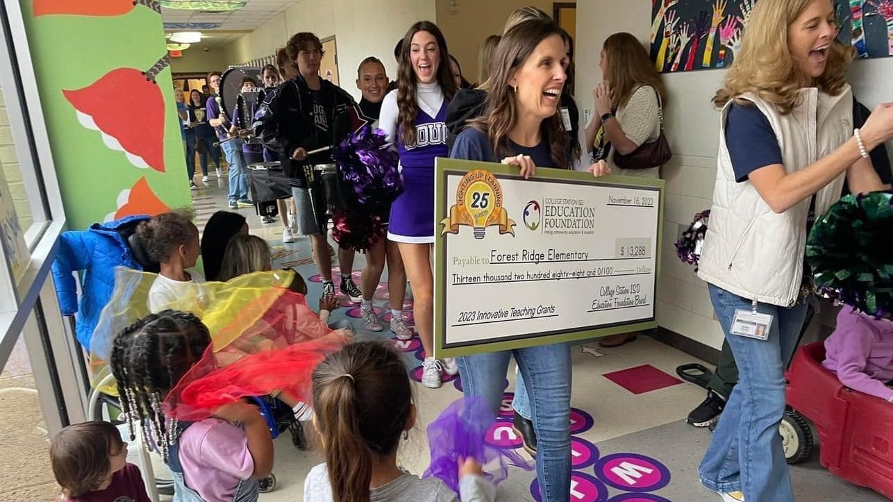 EF board member with big check during Grant Patrol