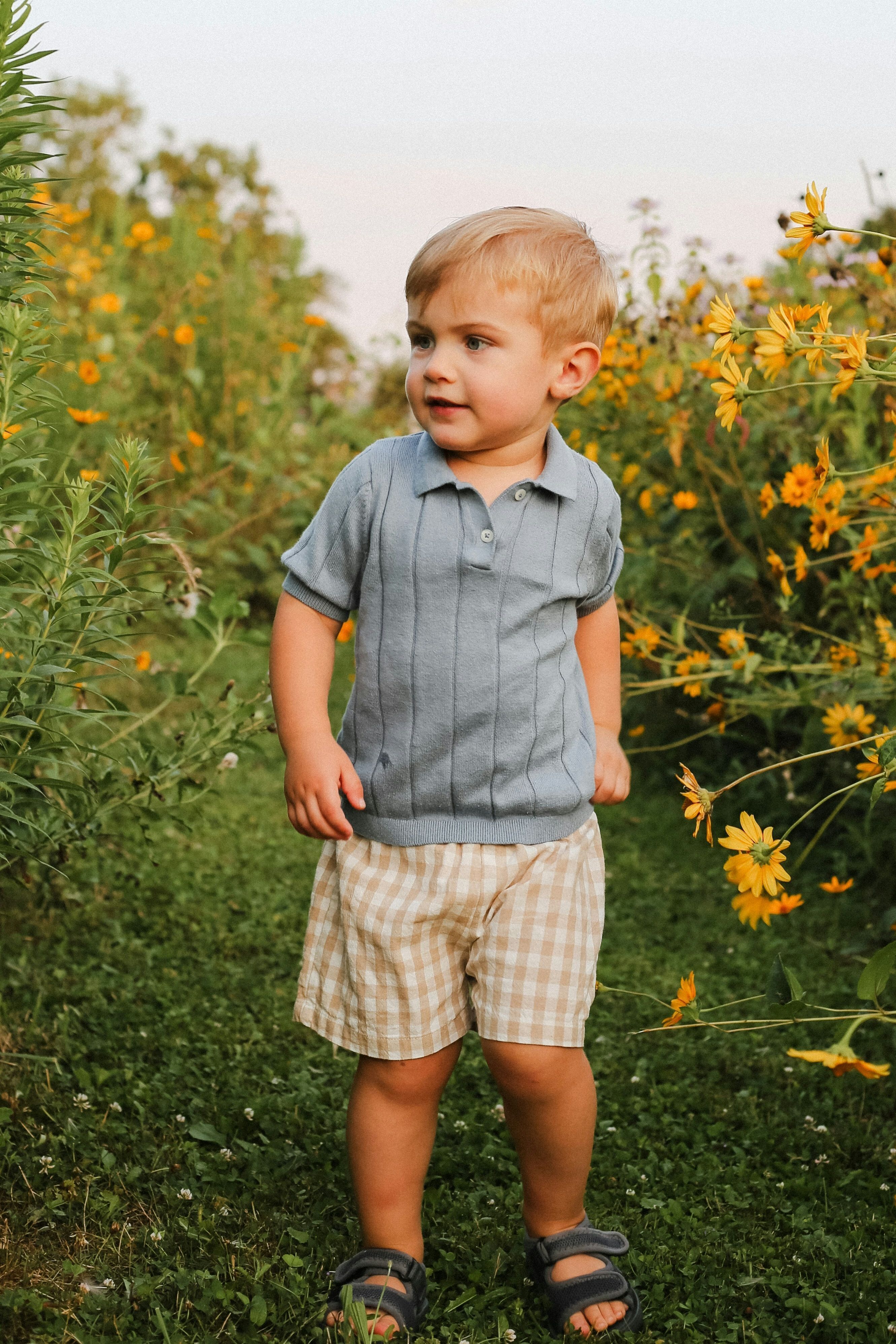 young boy in an orange jacket