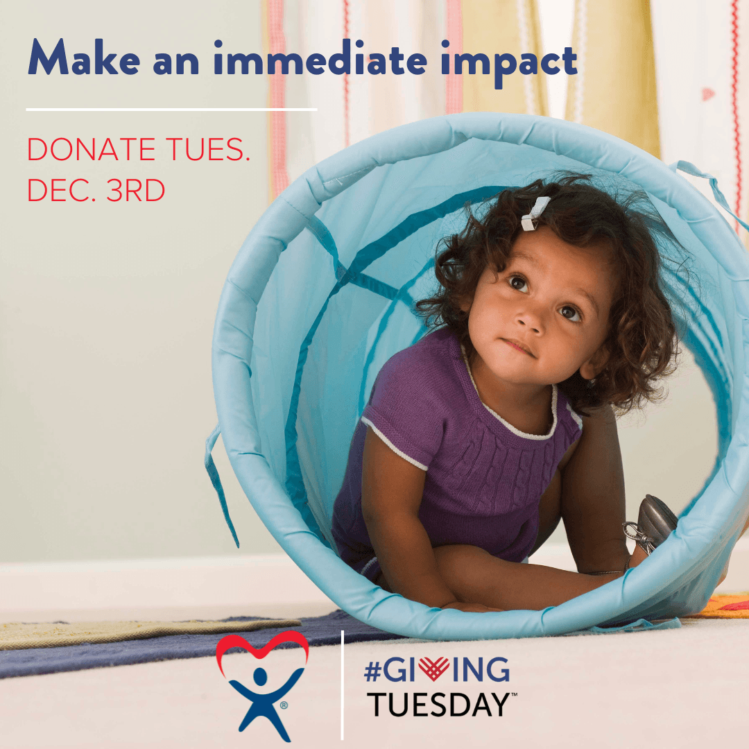 toddler playing with #givingtuesday logo