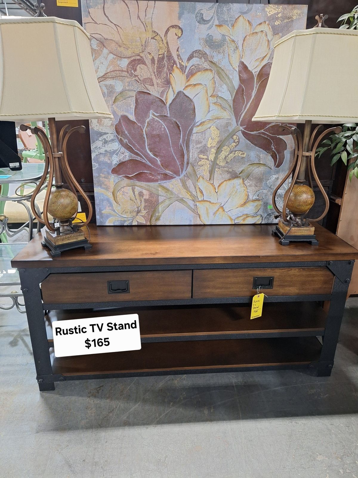 Rustic wood and metal TV stand with open shelving and drawers for living room organization at Habitat ReStore Zephyrhills – $165