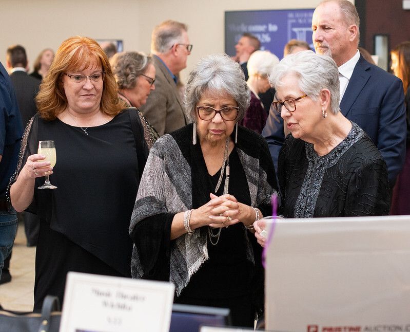 Guests shop silent auction items