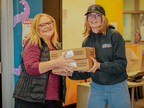 Volunteers working together during food distribution.