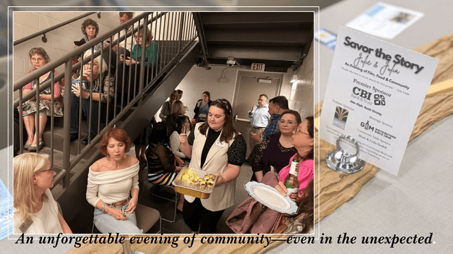 Guests gather in a library stairwell holding food and drinks during a tornado warning at the Savor the Story event, continuing conversation and connection.