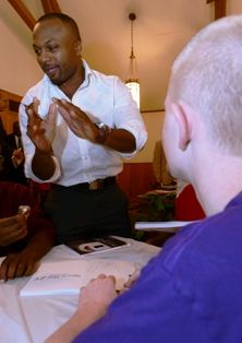 Football standout Anthony Madison addresses WOS students