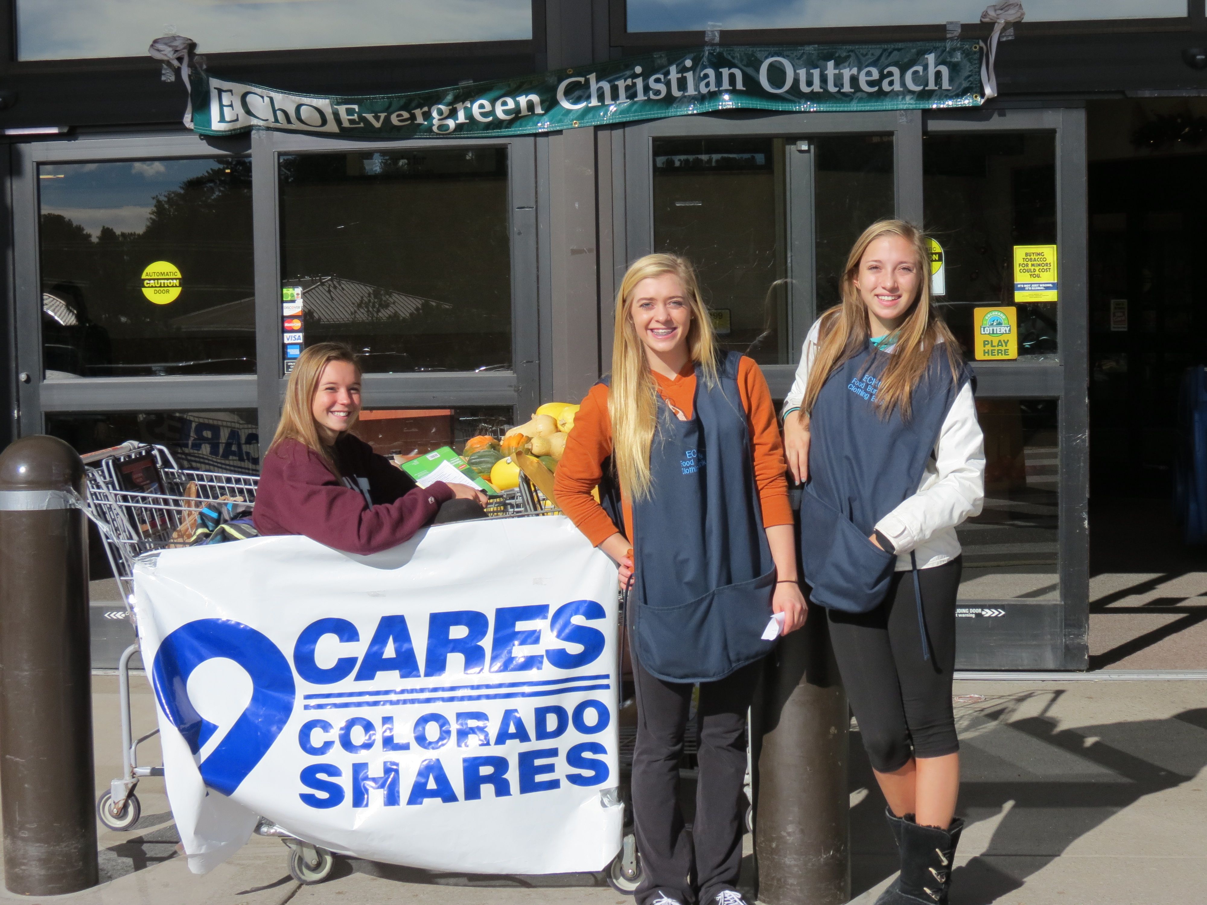 9 Cares Food Drive with three young volunteers