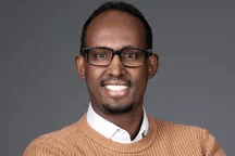 Portrait of Mukhtar M Ibrahim smiling