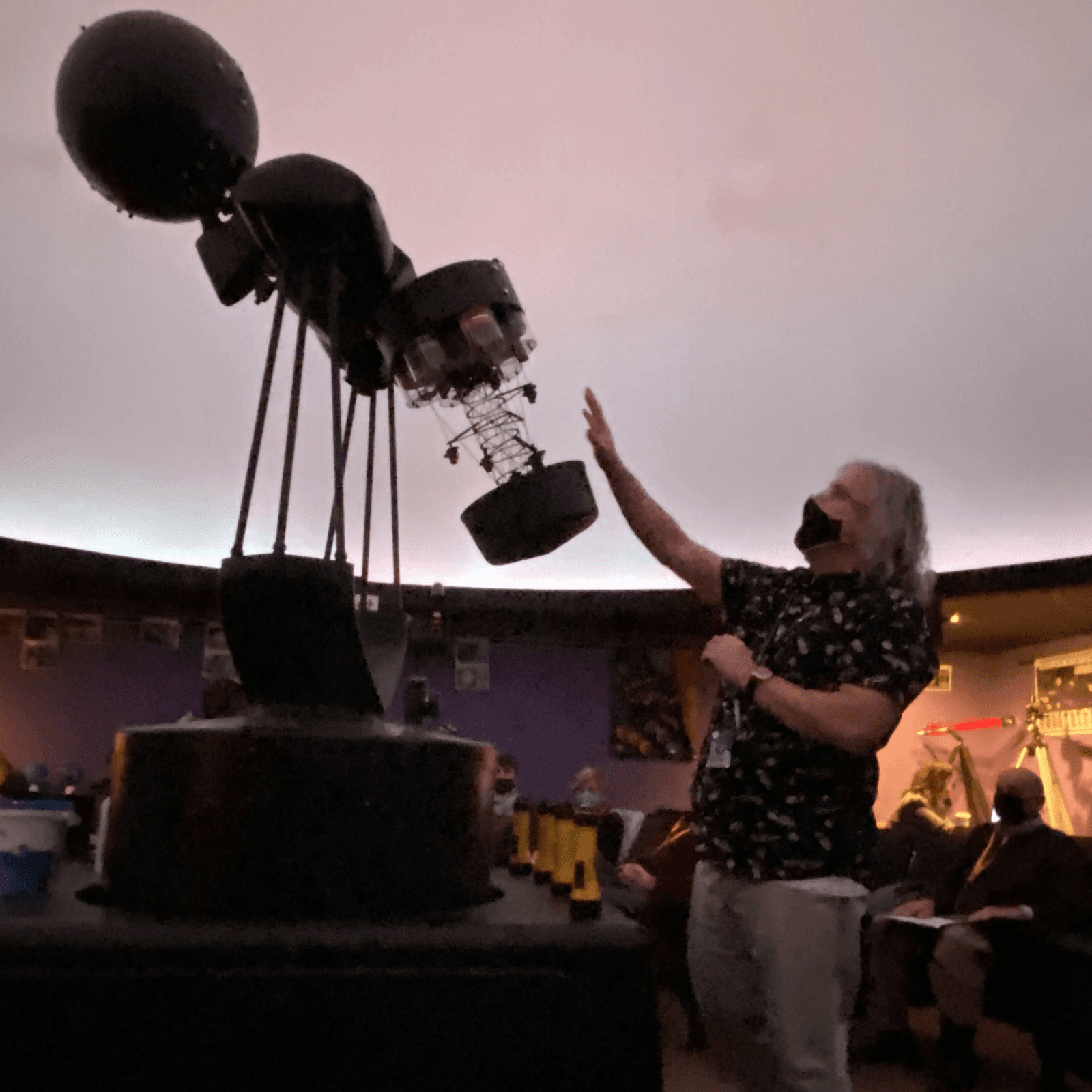 James Bauman, Planetarium Director, shows off the previous version of planetarium technology. 