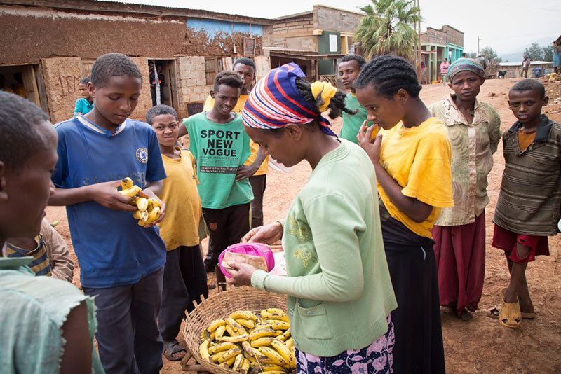 Selling bananas.