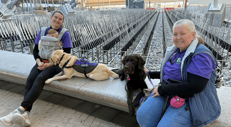 Two clients training with their hearing dog partners