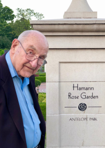 Don in front of Hamann Rose Garden sign.