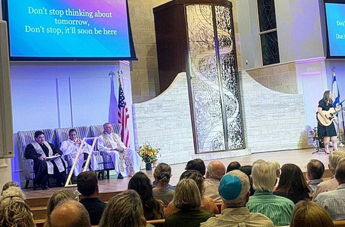 Jupiter clergy including Pastor Chip Jurskis, left, of JupiterFirst Church, Rabbi Alon Levkovitz of Temple Beth Am and Father Don Finney of St. Peter Parish, gather for a past interfaith service at the synagogue.