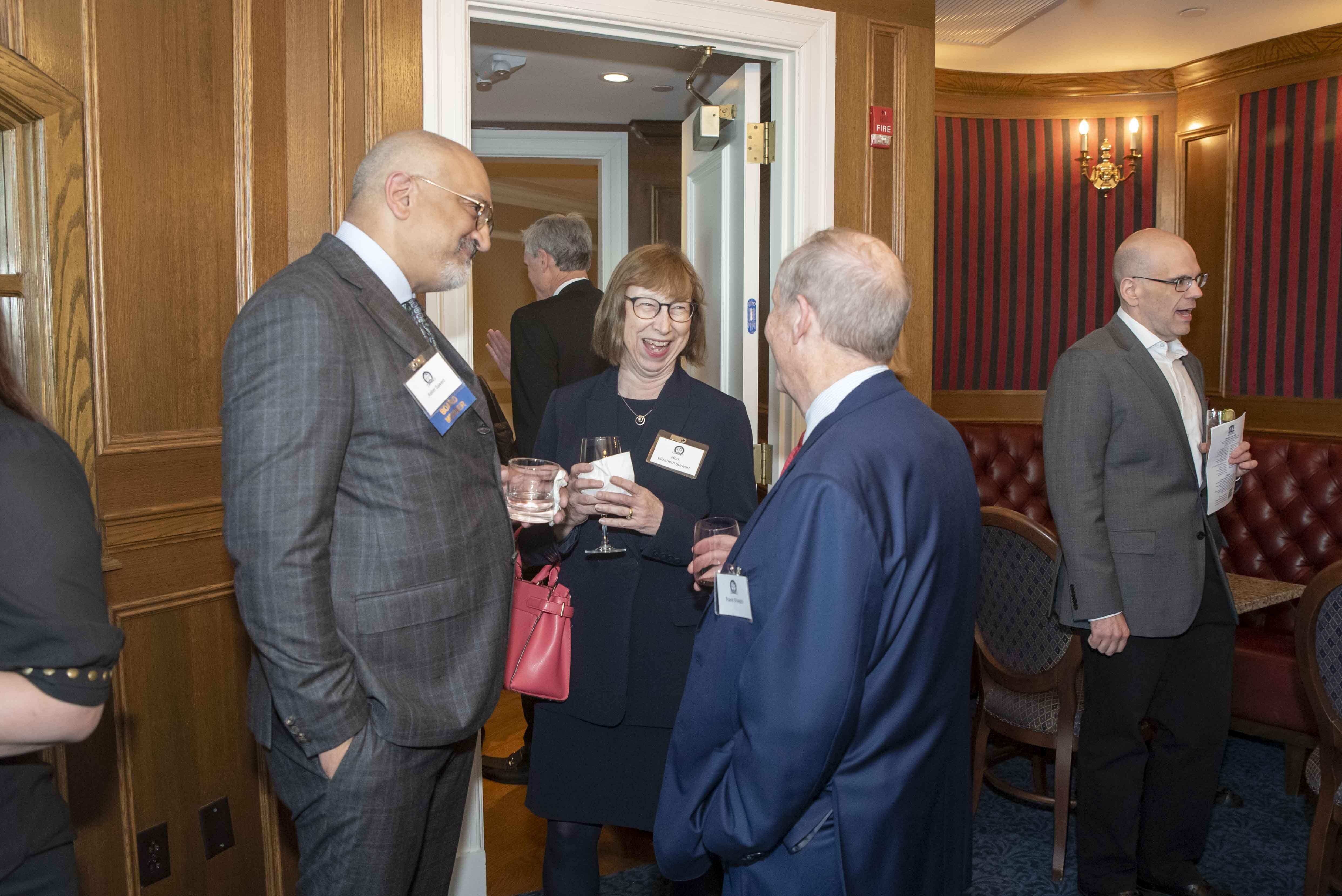 Three Attorneys/Fellows speaking during Reception