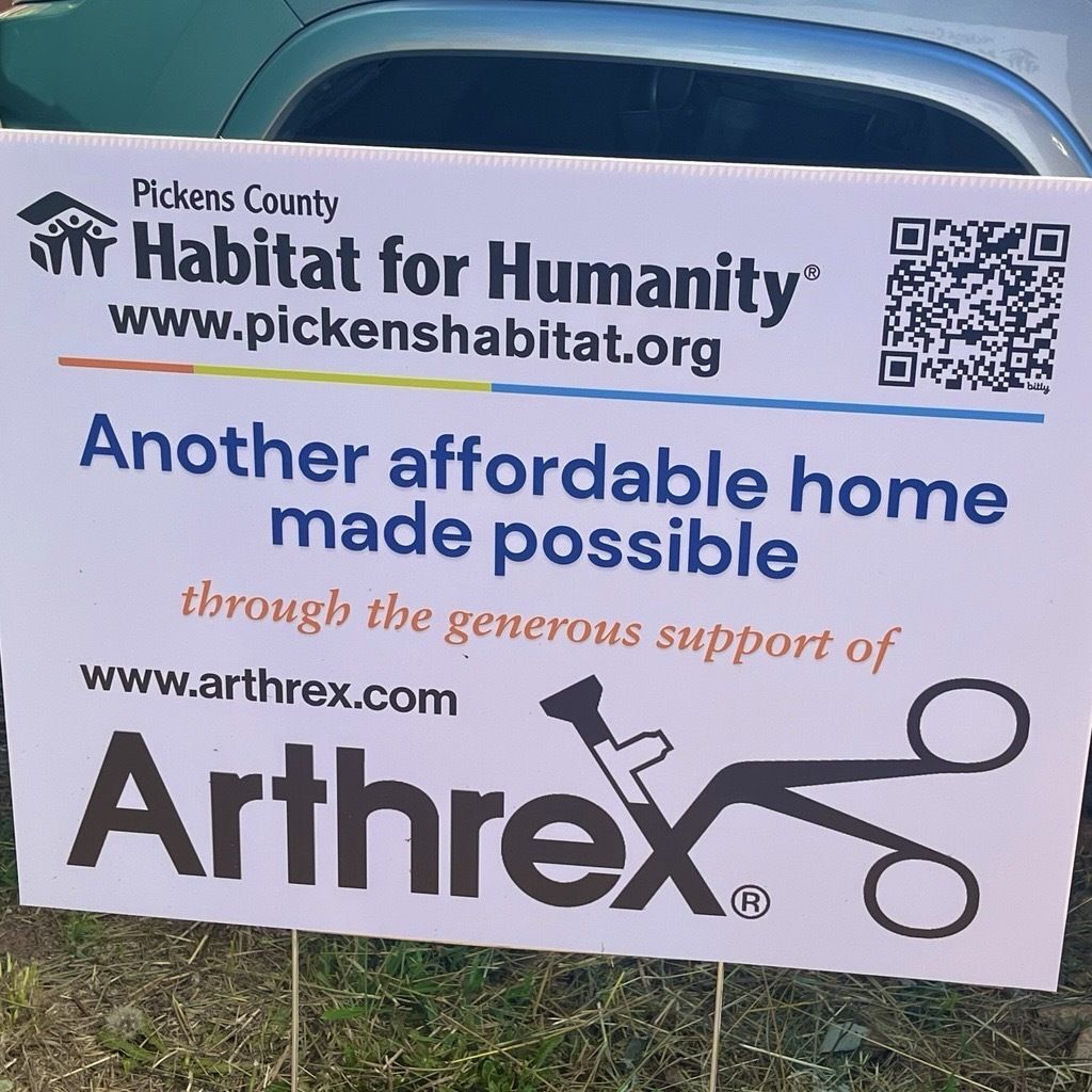 Thank you sign for Arthrex displayed at a Habitat for Humanity build site in Pickens County.