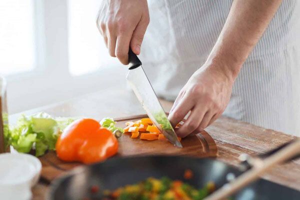 Chef chopping vegetables.