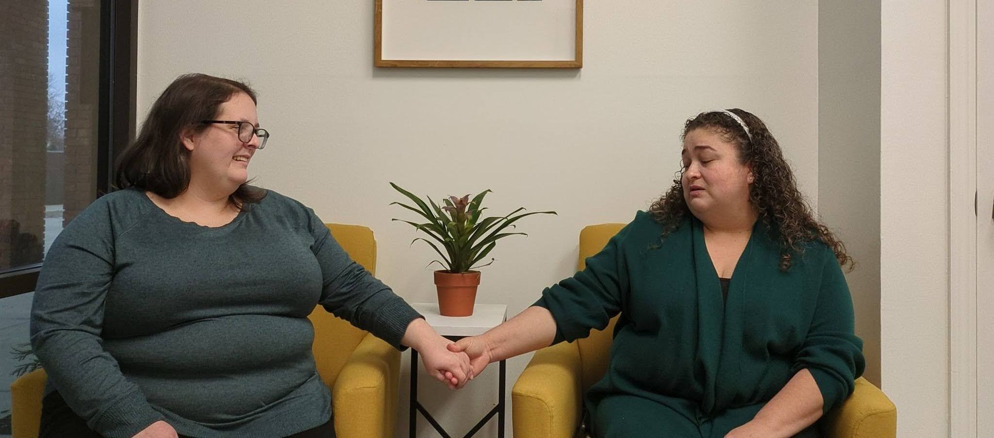 Executive Director Mary Choate speaks with Alejandra