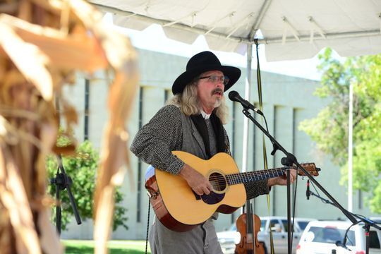 Singer David Zerf performing at the Smoky Hill Museum Street Fair.