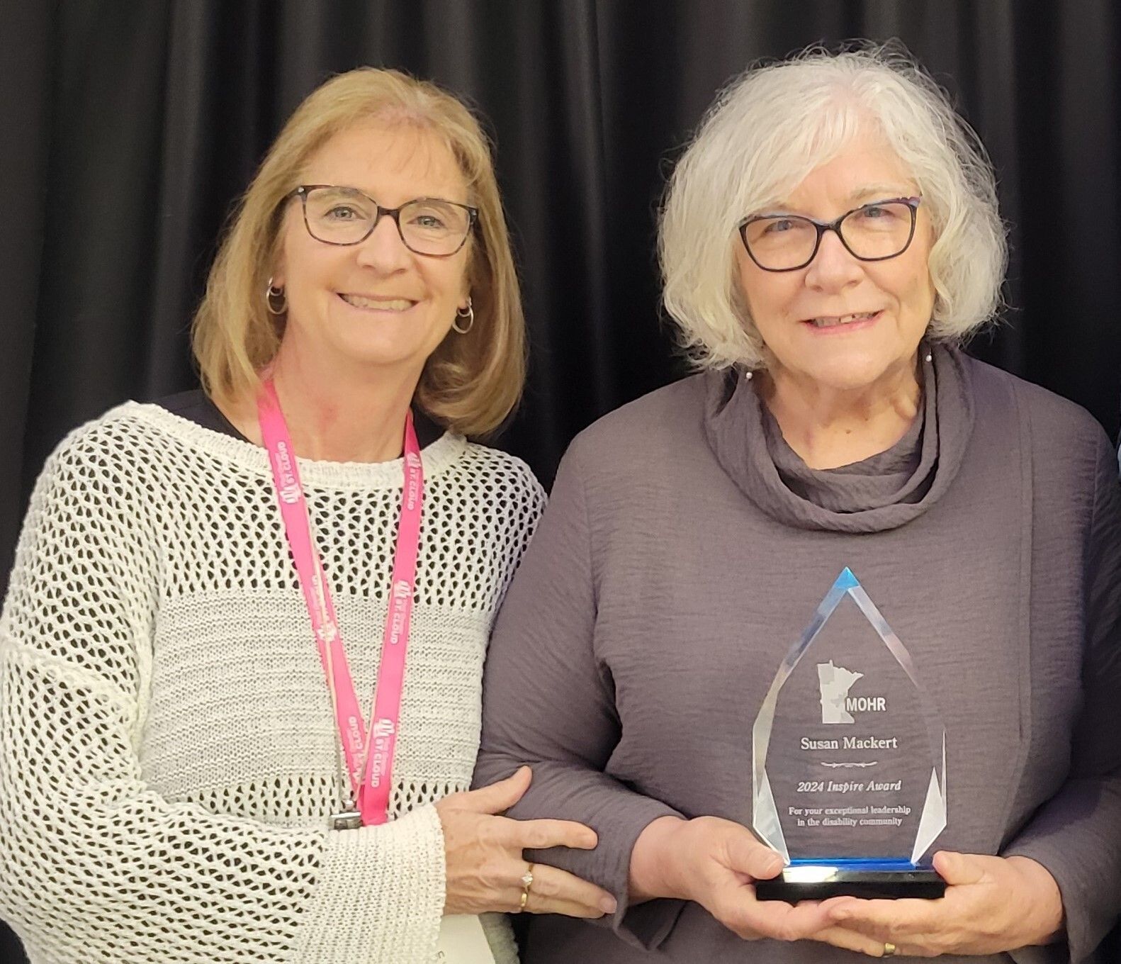 Sue Mackert, Executive Director of PossAbilities accepting the 2024 Inspire Award from MOHR President Robin Harkonen