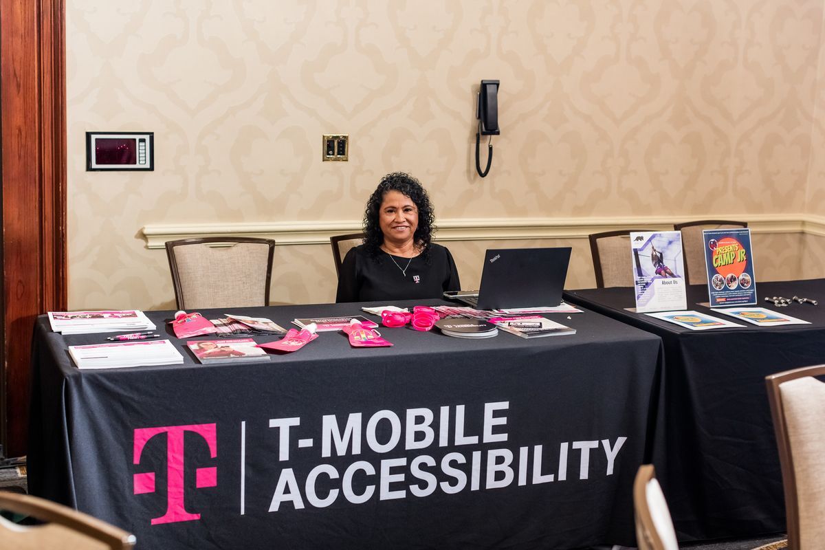 A T-Mobile Accessibility representative sitting at her table. 