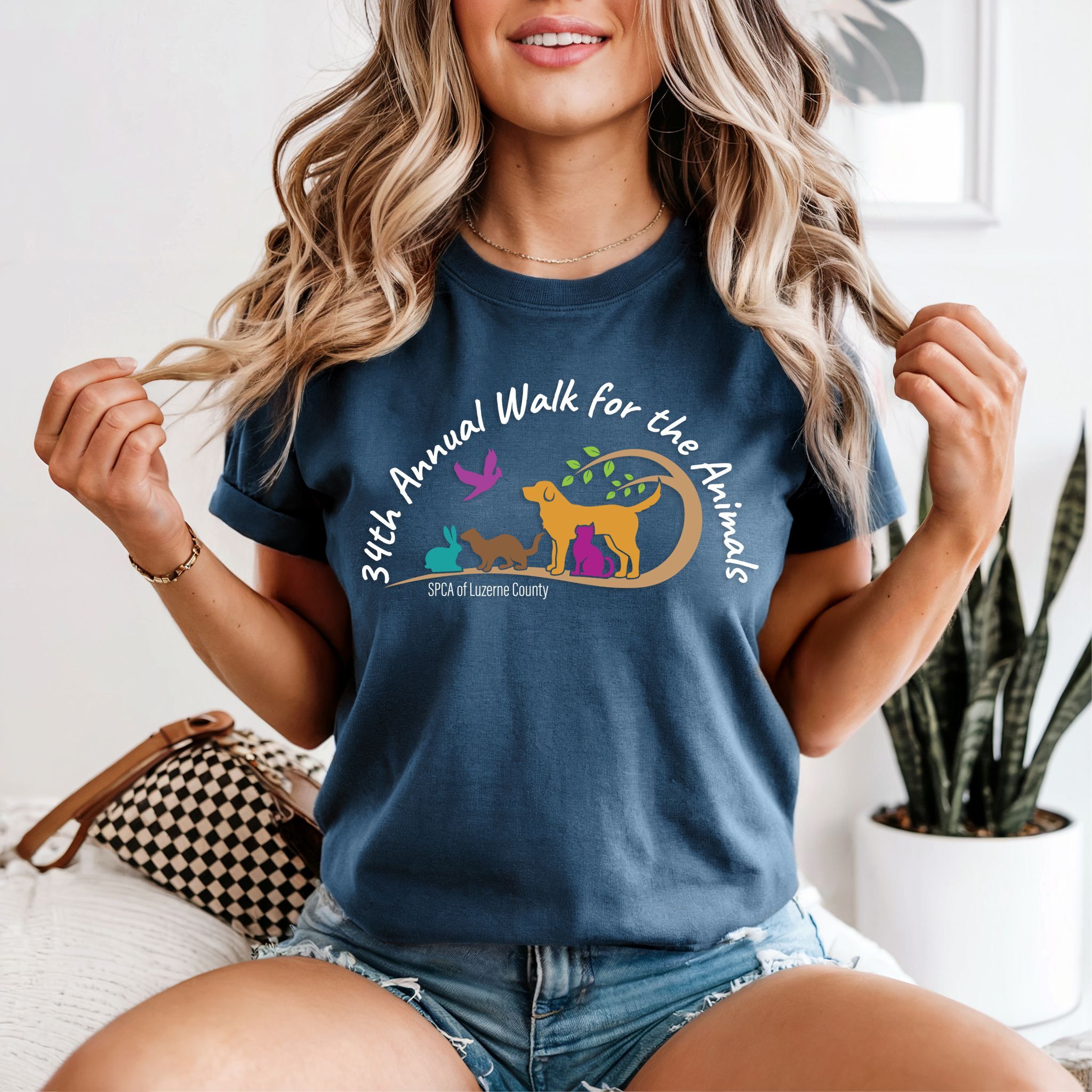 Support our furry friends by purchasing a Walk for the Animals Tee!