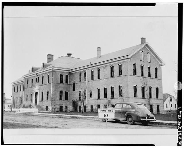 Exterior of boy's dormitory at an Indigenous boarding school in La Plata County, CO. 1942. Photographer unknown.