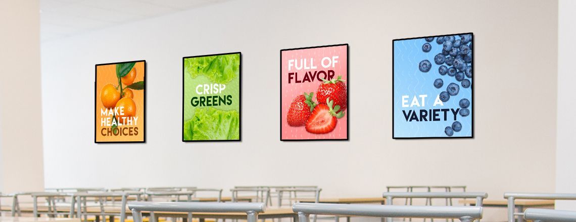 School café serving line with 2 food education posters on wall, white posters with nutrition facts