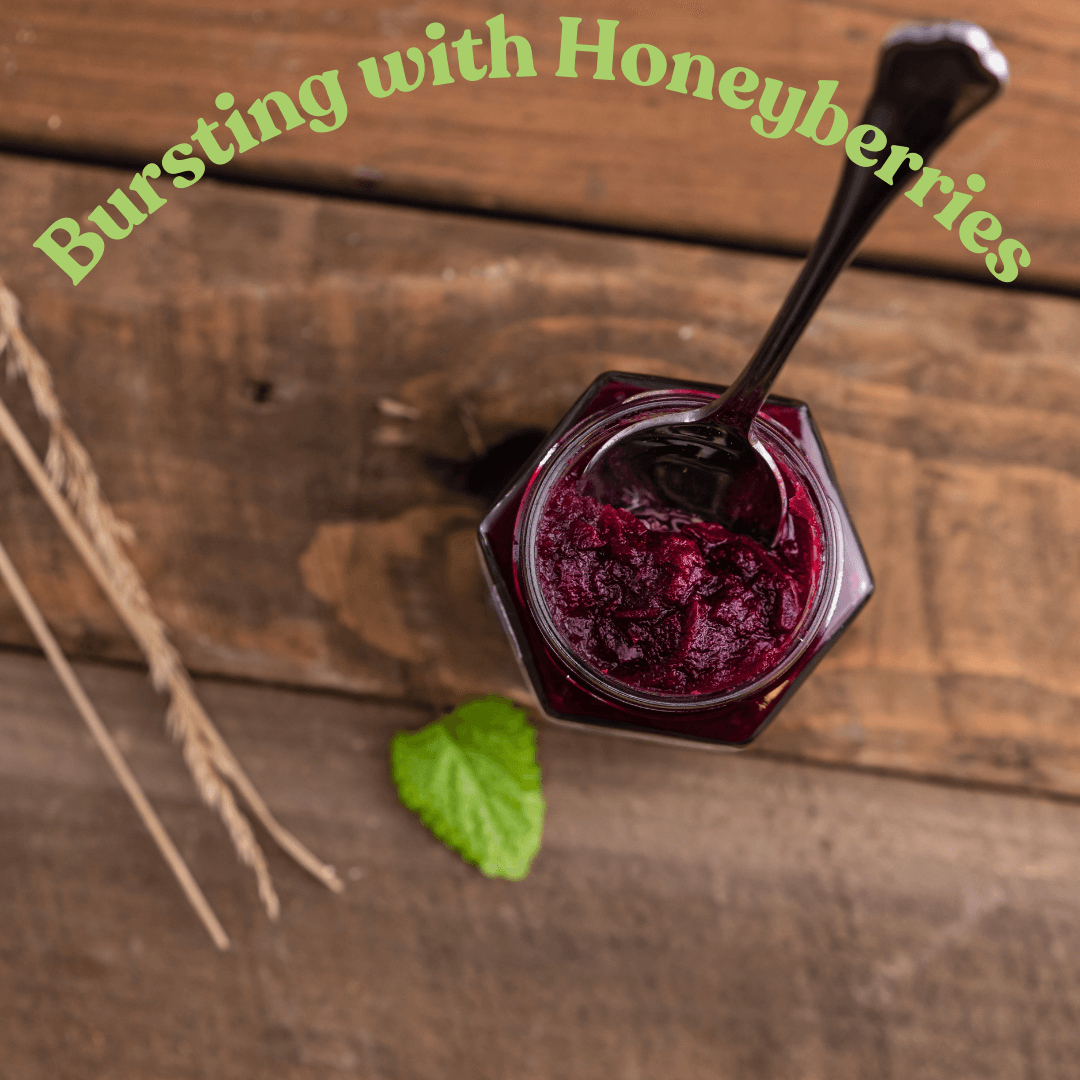 Jar of berry jam on wooden table.