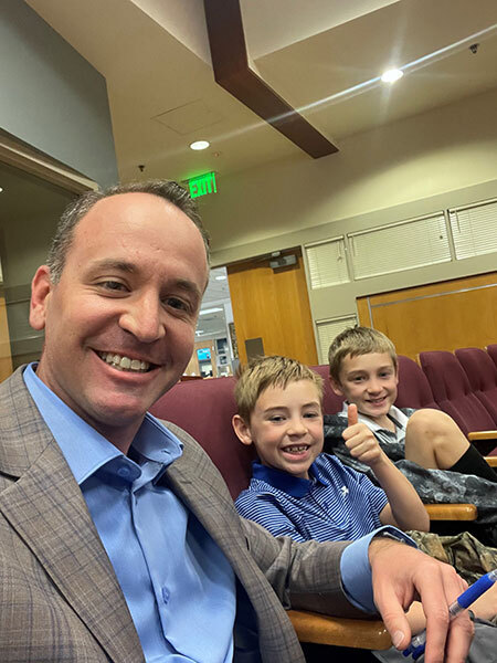 Alec with his two school aged sons.