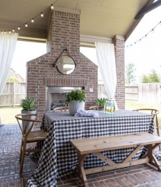 Backyard patio with fireplace and string lights featured on Crazy Wonderful Blog.