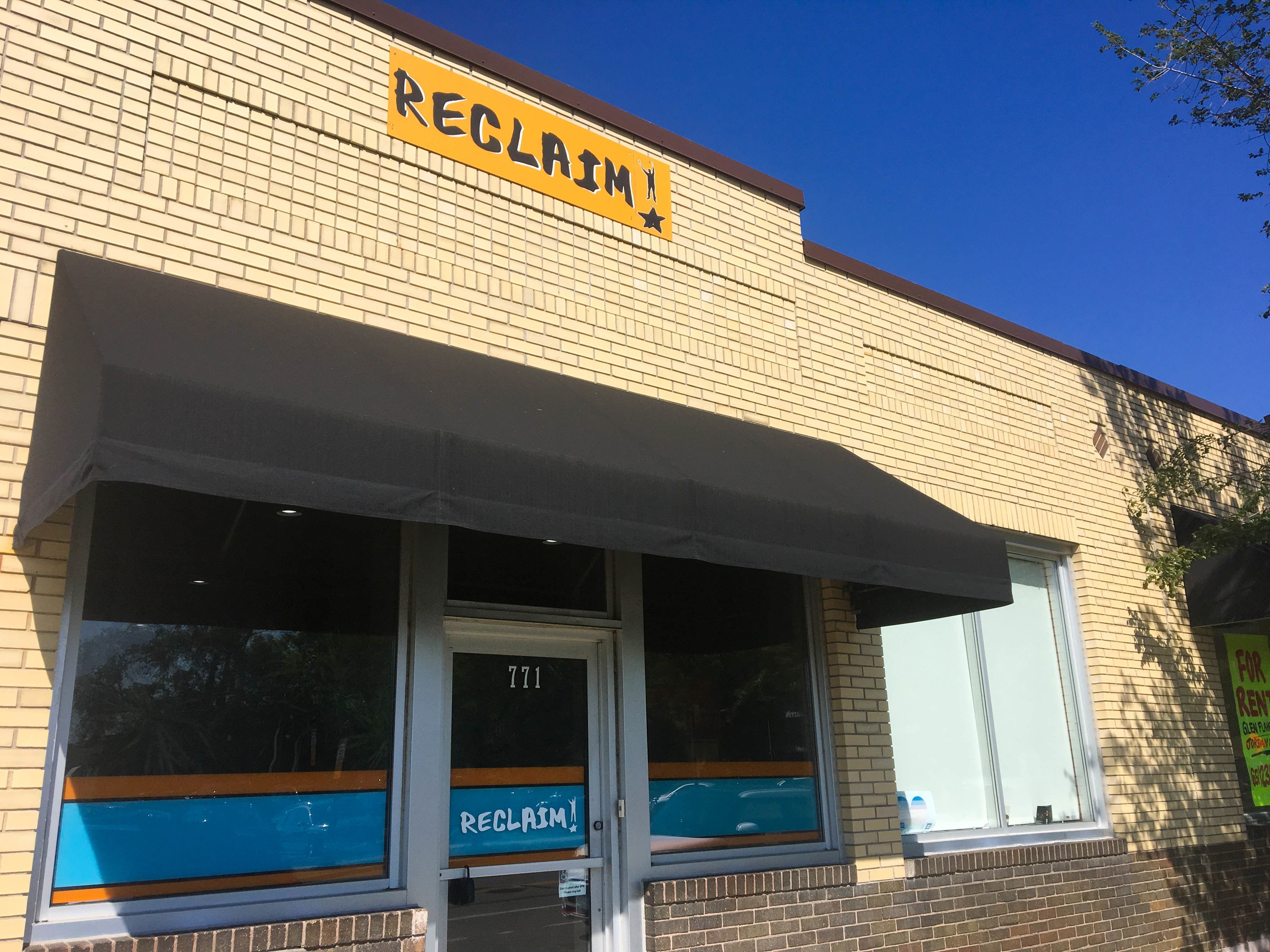 A picture of RECLAIM's office building from the front sidewalk.