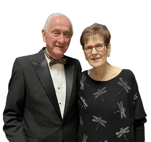 Photo of a smiling couple in formal black attire