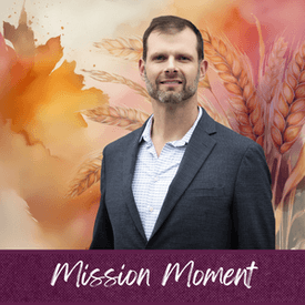 Brian Levander headshot against watercolor background in fall colors