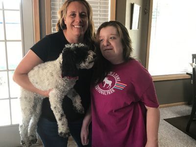 Picture of girl with her mother and dog